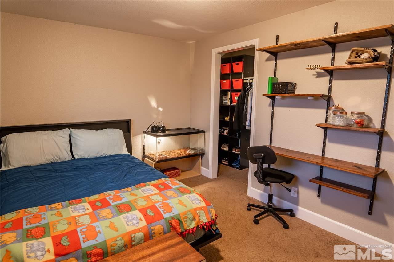 9335 Fremont Way Reno, NV 89506 - Photo 11 of 16 a bedroom with furniture and a bed