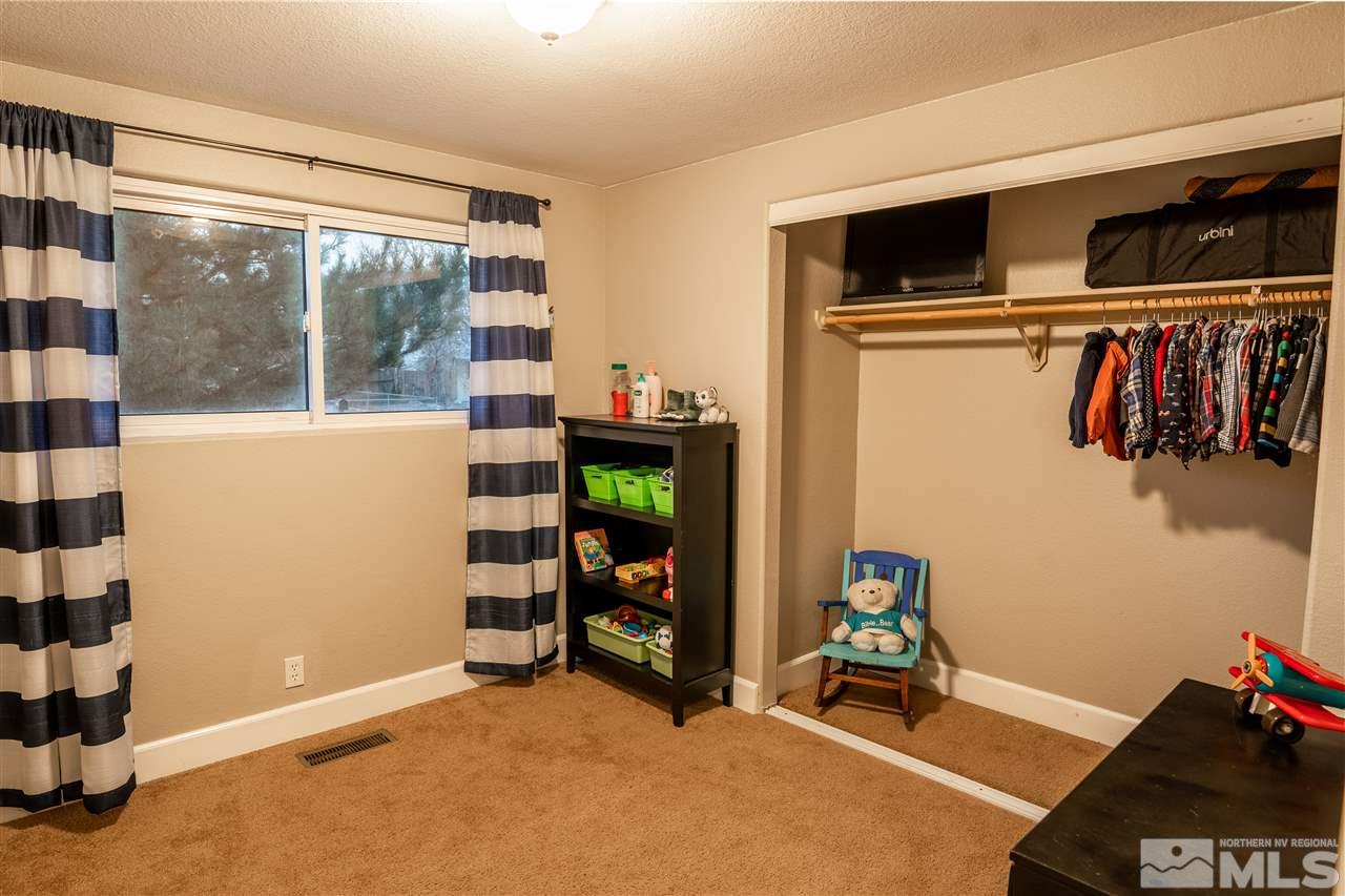 9335 Fremont Way Reno, NV 89506 - Photo 12 of 16 a view of a room with gym equipment and a window