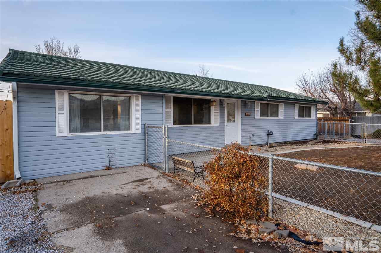 9335 Fremont Way Reno, NV 89506 - Photo 13 of 16 a front view of a house with yard