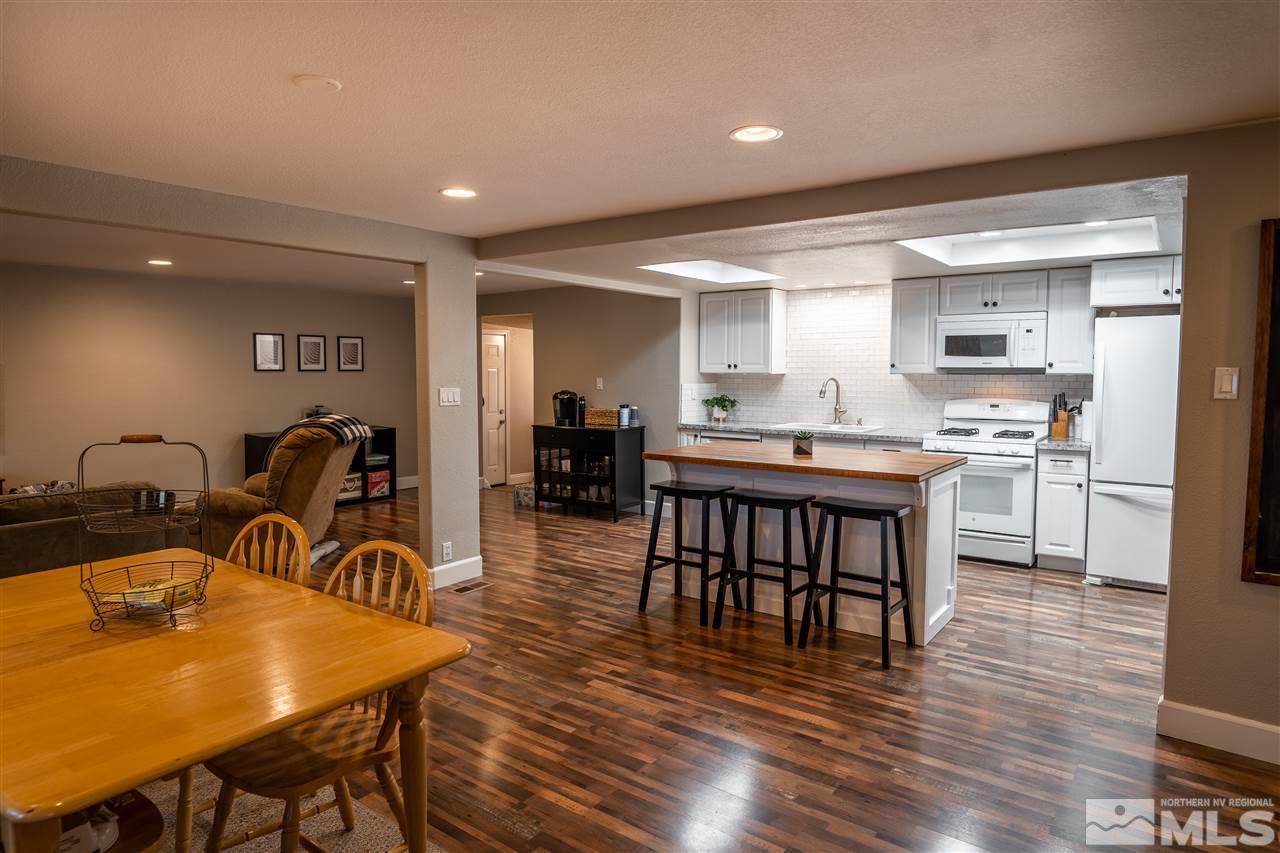 9335 Fremont Way Reno, NV 89506 - Photo 3 of 16 a dining room with furniture and wooden floor