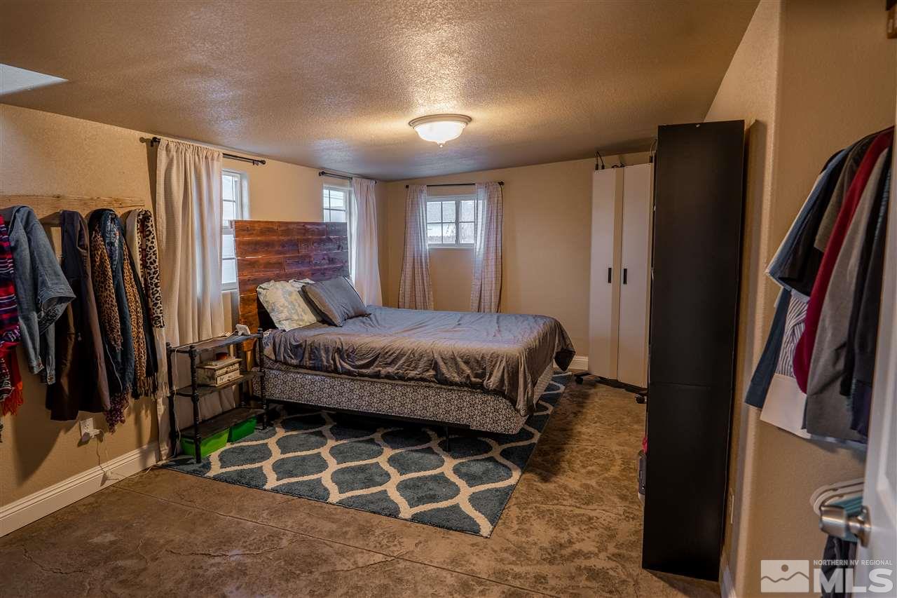 9335 Fremont Way Reno, NV 89506 - Photo 6 of 16 a bedroom with a bed closet and a window