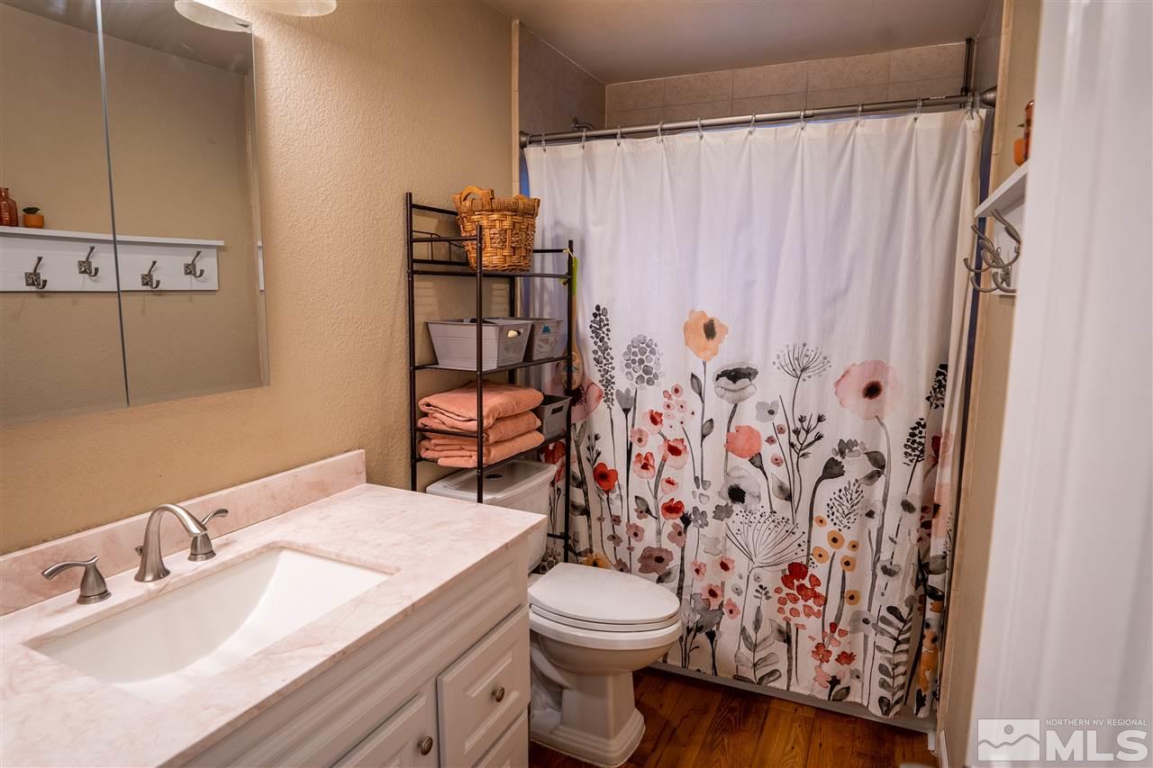 9335 Fremont Way Reno, NV 89506 - Photo 7 of 16 a bathroom with a sink toilet and shower