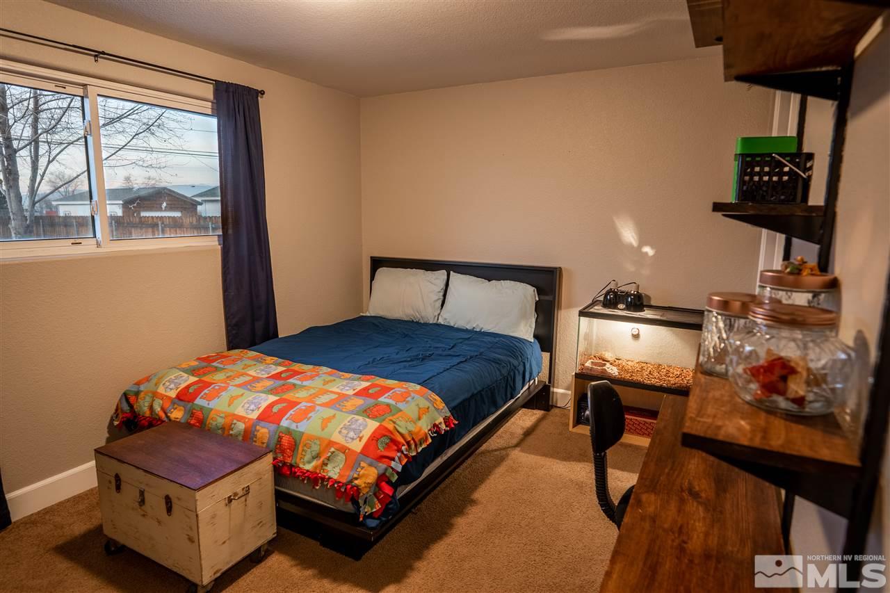 9335 Fremont Way Reno, NV 89506 - Photo 10 of 16 a bedroom with a bed and a window