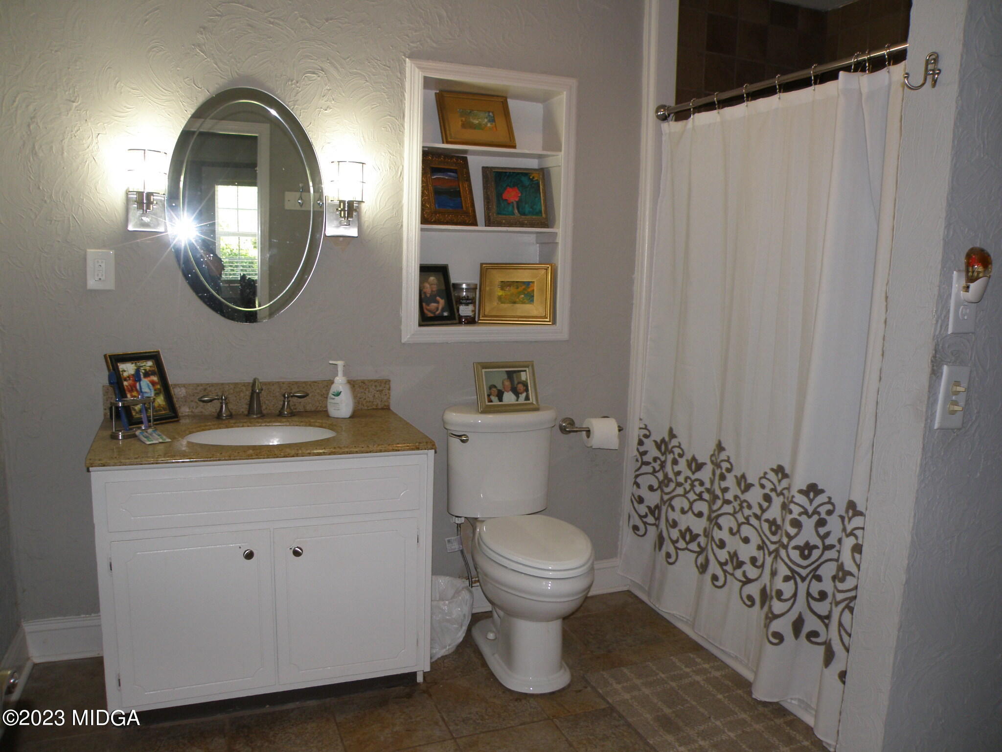 388 Fairview Church Road Forsyth, GA 31029 - Photo 12 of 41 a bathroom with a toilet a sink and a mirror