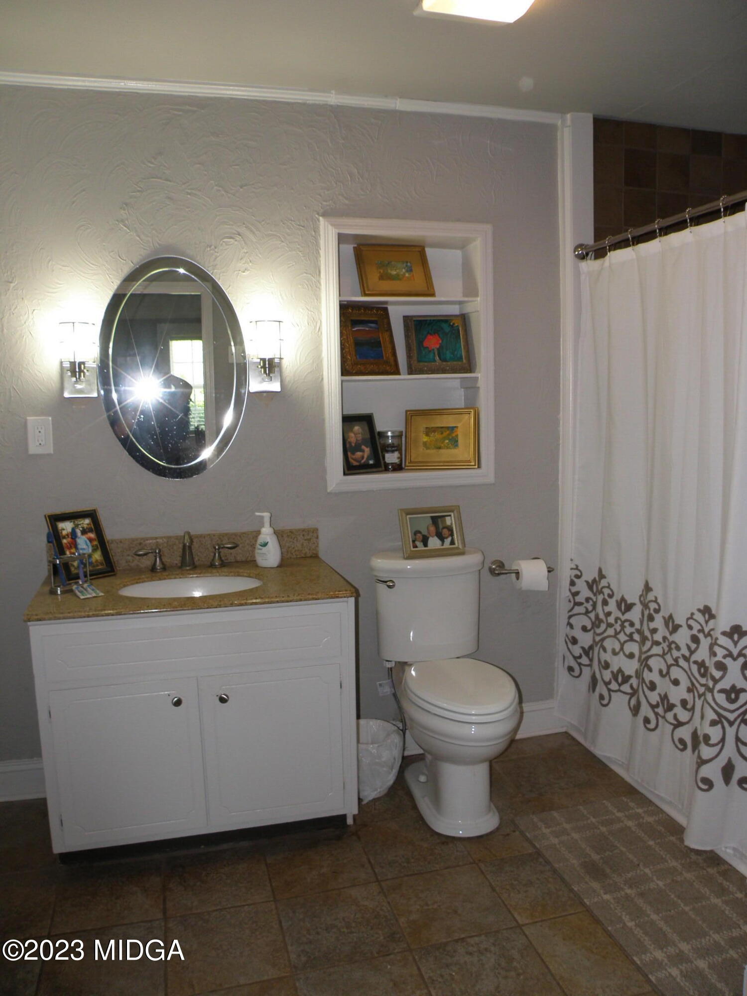 388 Fairview Church Road Forsyth, GA 31029 - Photo 13 of 41 a bathroom with a toilet a sink and a mirror