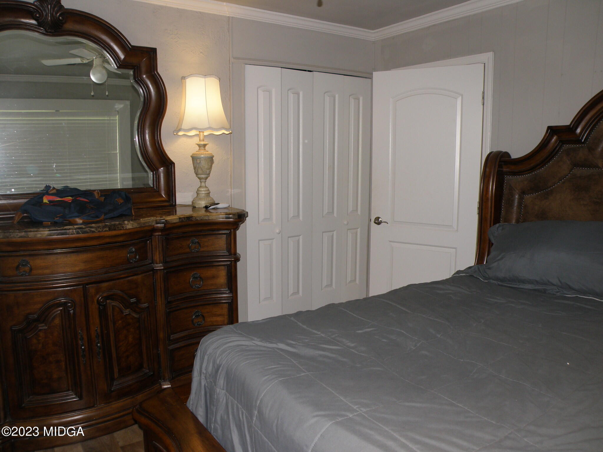 388 Fairview Church Road Forsyth, GA 31029 - Photo 16 of 41 a bedroom with a bed and a mirror