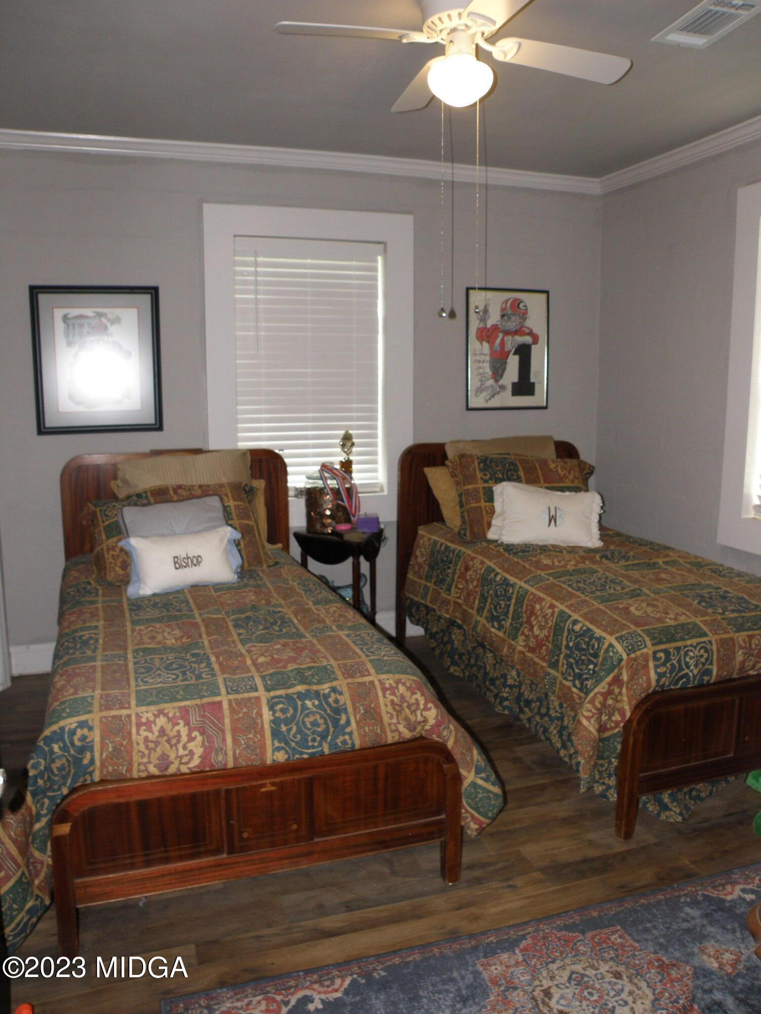 388 Fairview Church Road Forsyth, GA 31029 - Photo 19 of 41 a bedroom with a bed and a chandelier