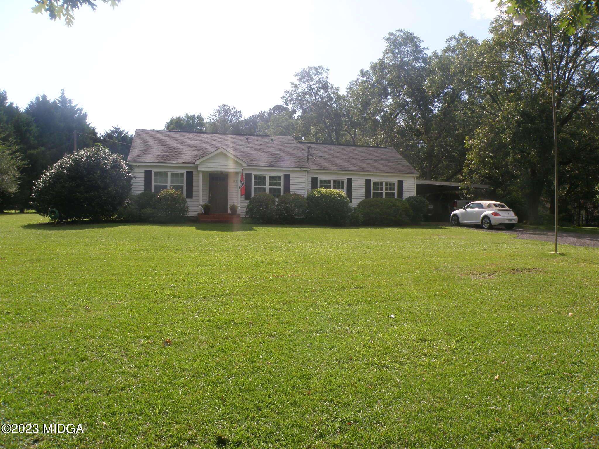 388 Fairview Church Road Forsyth, GA 31029 - Photo 2 of 41 a view of house with yard and outdoor seating