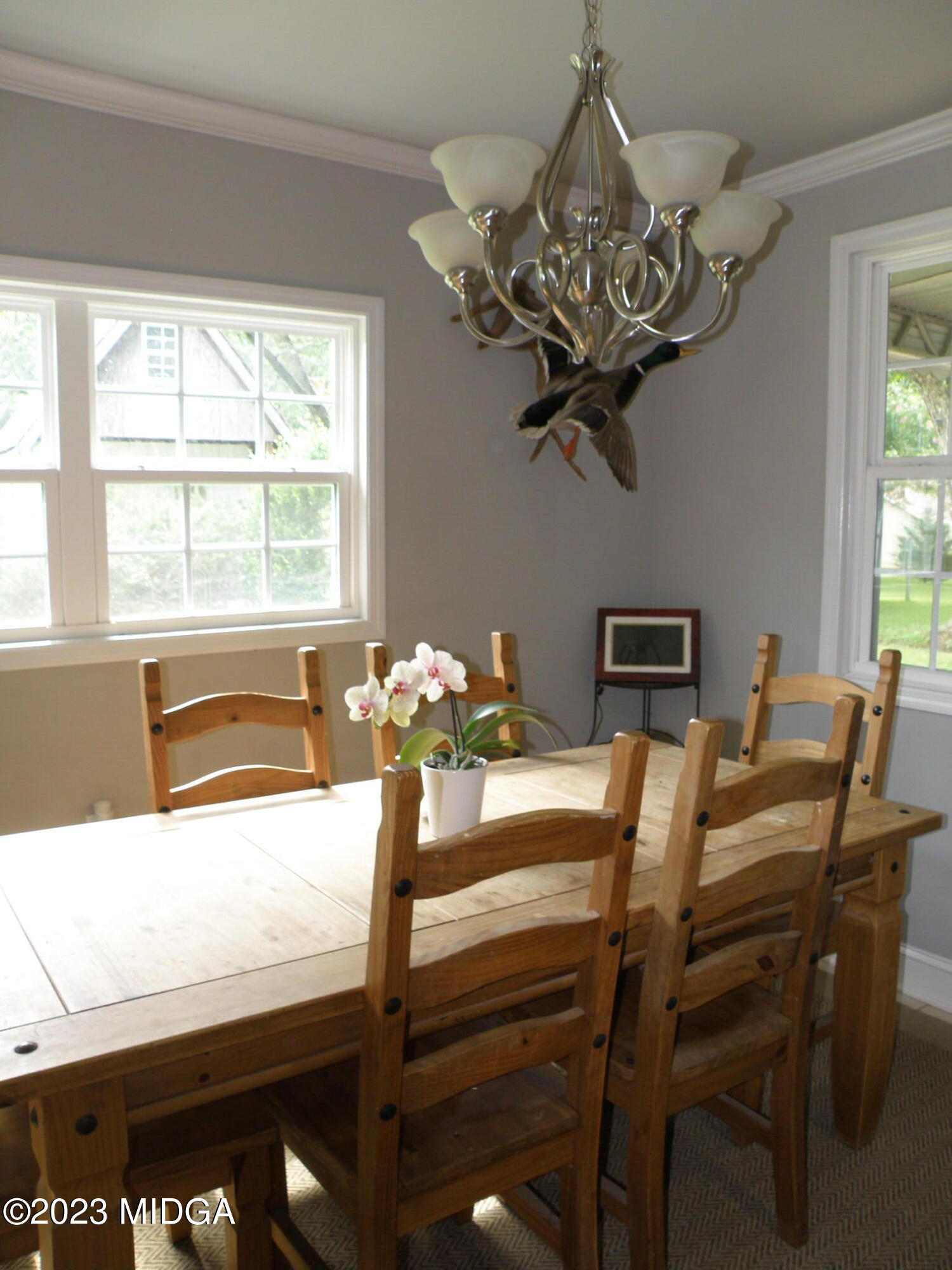 388 Fairview Church Road Forsyth, GA 31029 - Photo 21 of 41 a view of a dining room with furniture a chandelier and a window