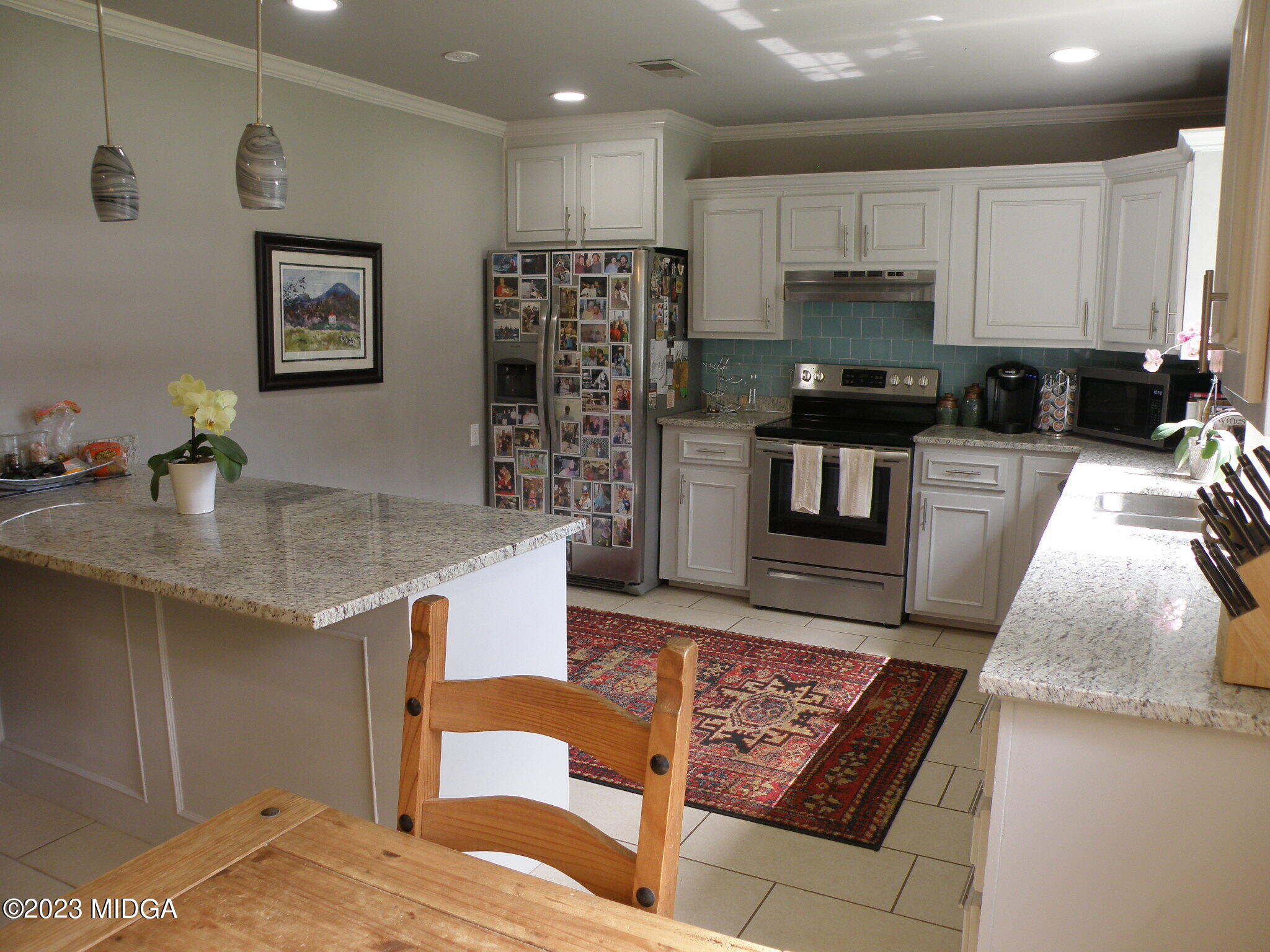 388 Fairview Church Road Forsyth, GA 31029 - Photo 23 of 41 a kitchen with stainless steel appliances granite countertop a stove top oven a sink a counter space and cabinets