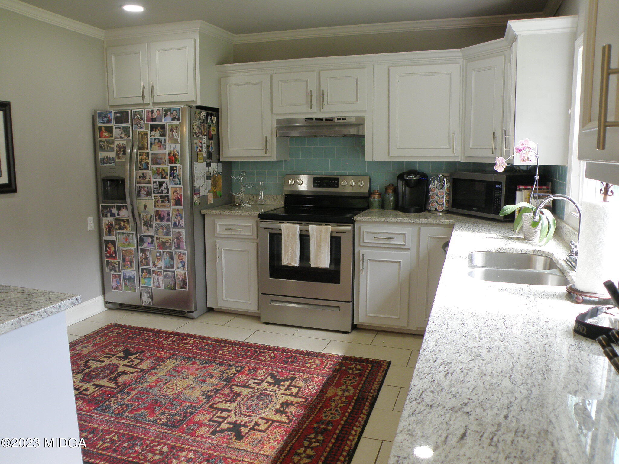 388 Fairview Church Road Forsyth, GA 31029 - Photo 24 of 41 a kitchen with stainless steel appliances granite countertop a refrigerator sink and stove