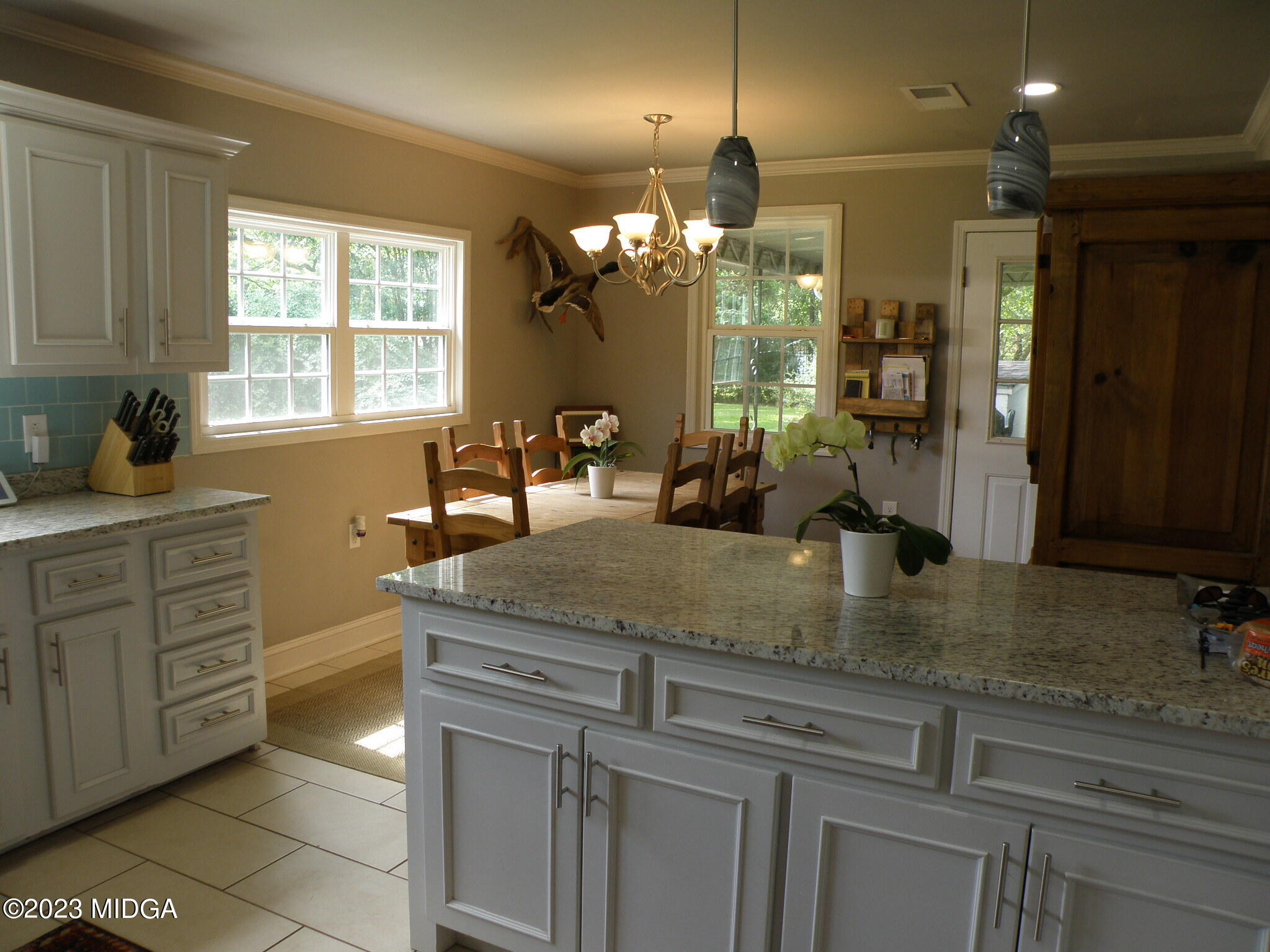 388 Fairview Church Road Forsyth, GA 31029 - Photo 26 of 41 a bathroom with a granite countertop sink a large mirror and a shower