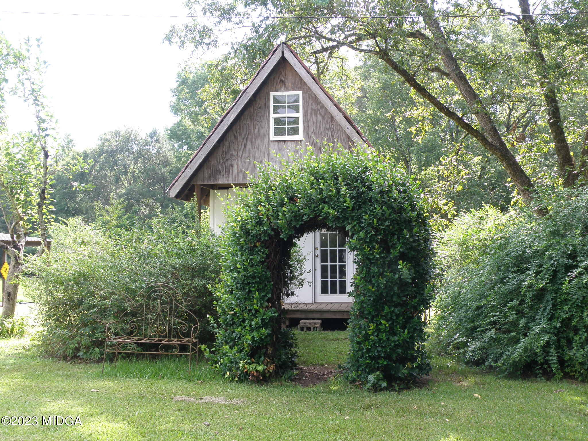 388 Fairview Church Road Forsyth, GA 31029 - Photo 28 of 41 a view of a house with a yard plants and large trees