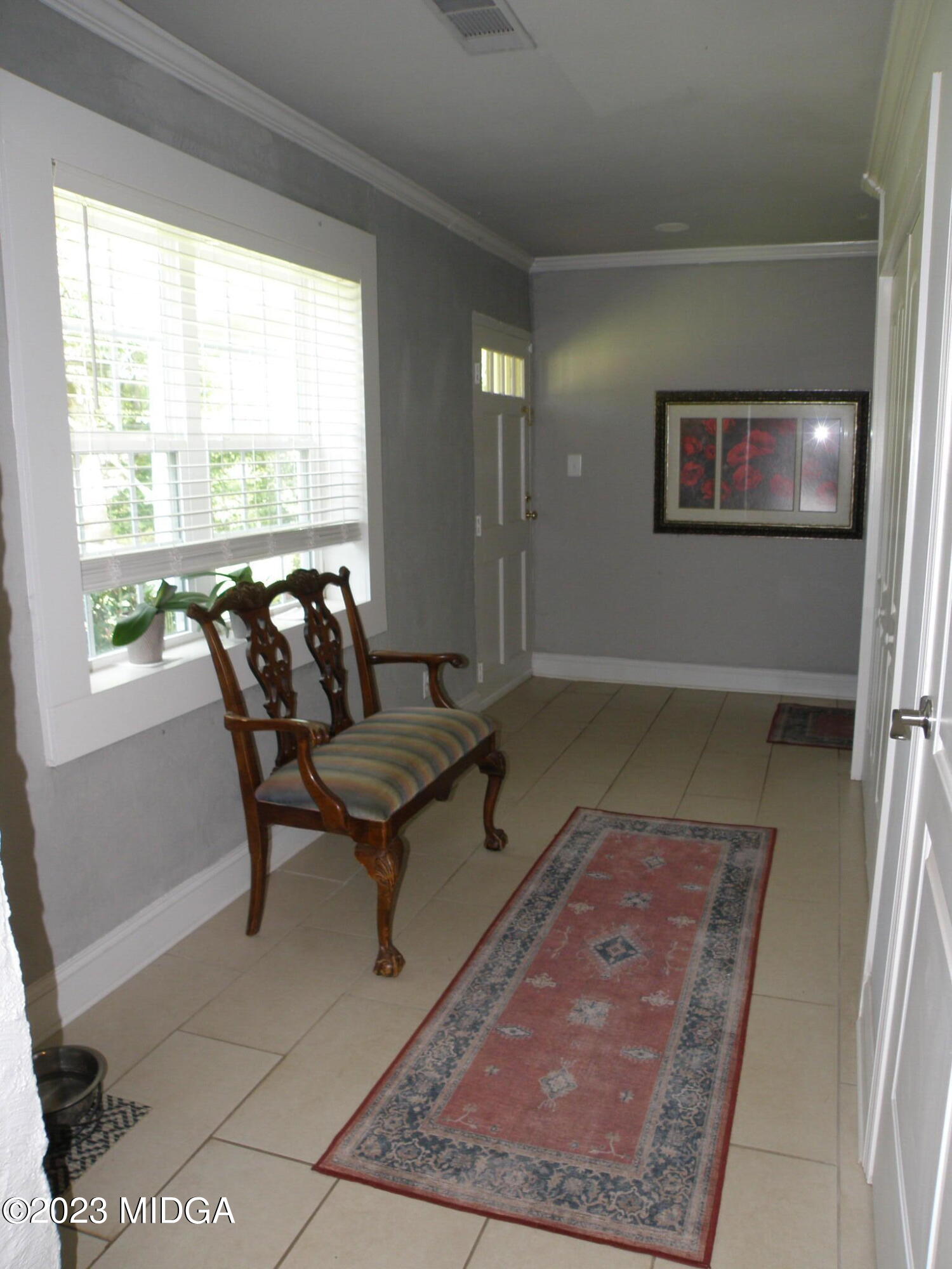 388 Fairview Church Road Forsyth, GA 31029 - Photo 4 of 41 a living room with a rug and a table