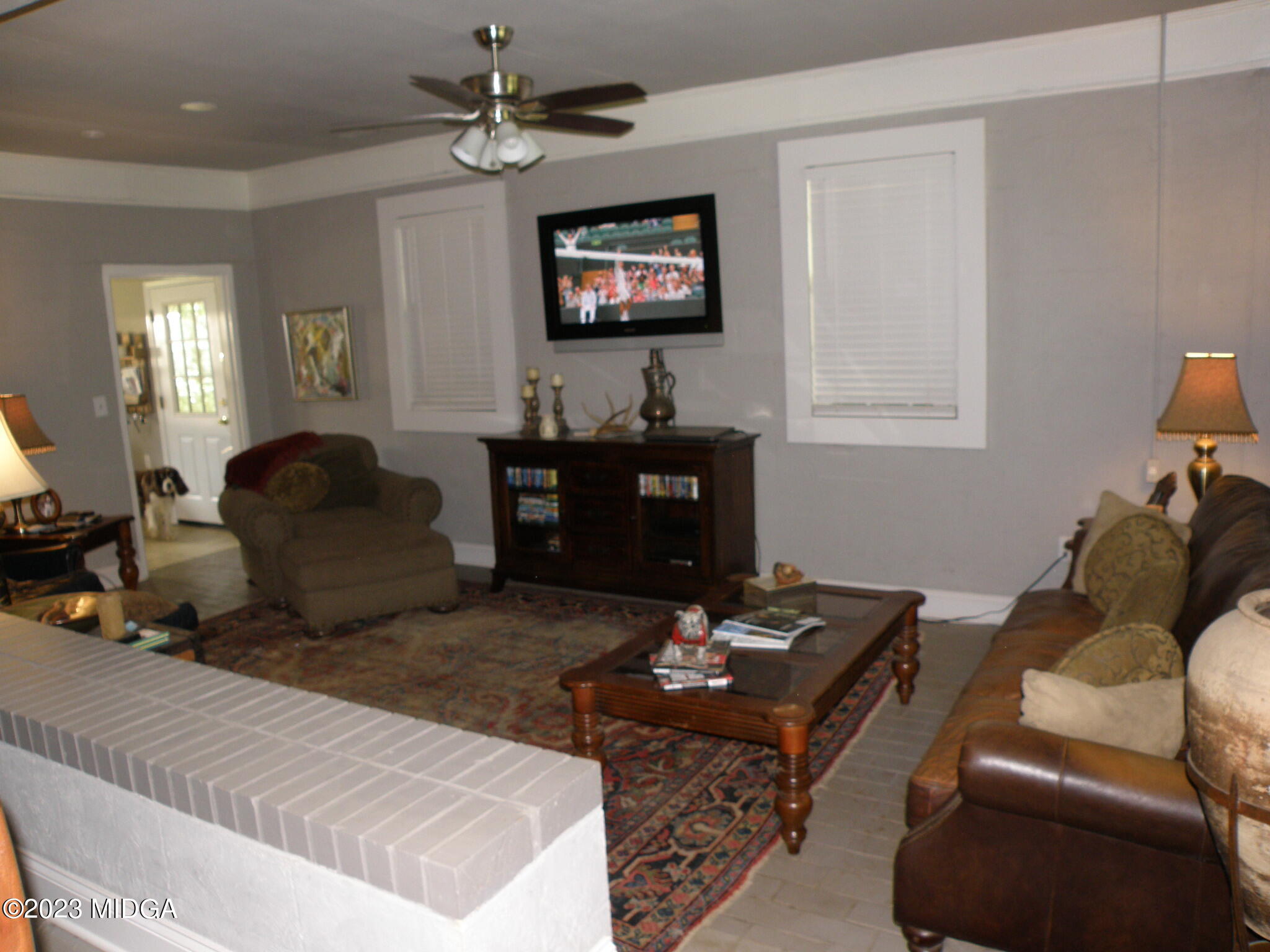 388 Fairview Church Road Forsyth, GA 31029 - Photo 9 of 41 a living room with furniture a window and a flat screen tv