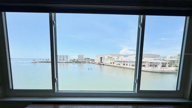 a view of living room with furniture and window