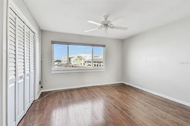 a view of a cafe with a table and chairs in front of it