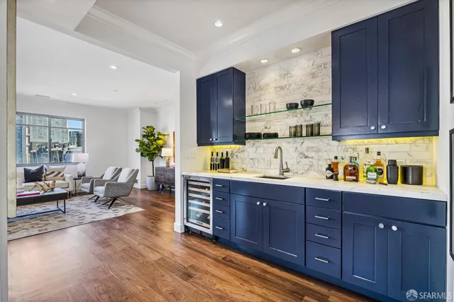 a kitchen with granite countertop a sink and wooden cabinets