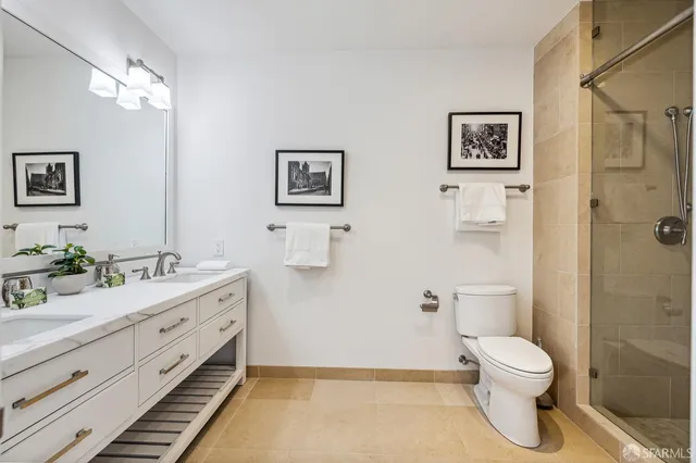 a view of closet with wooden floor
