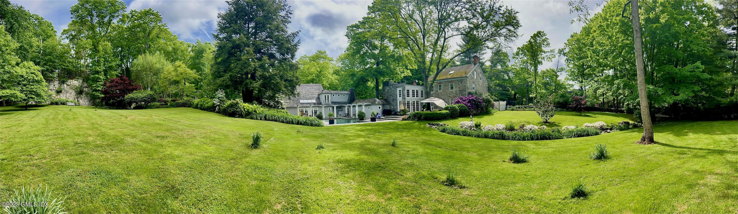 207 Farms Road Stamford, CT 06903 - Photo 13 of 47 a view of a garden with a fountain