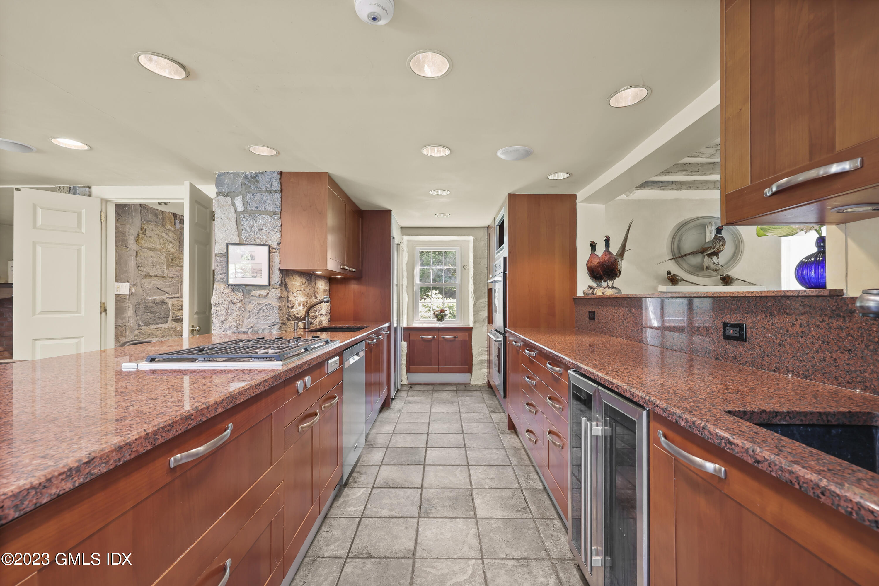 207 Farms Road Stamford, CT 06903 - Photo 18 of 47 a large kitchen with stainless steel appliances lots of counter space and a sink