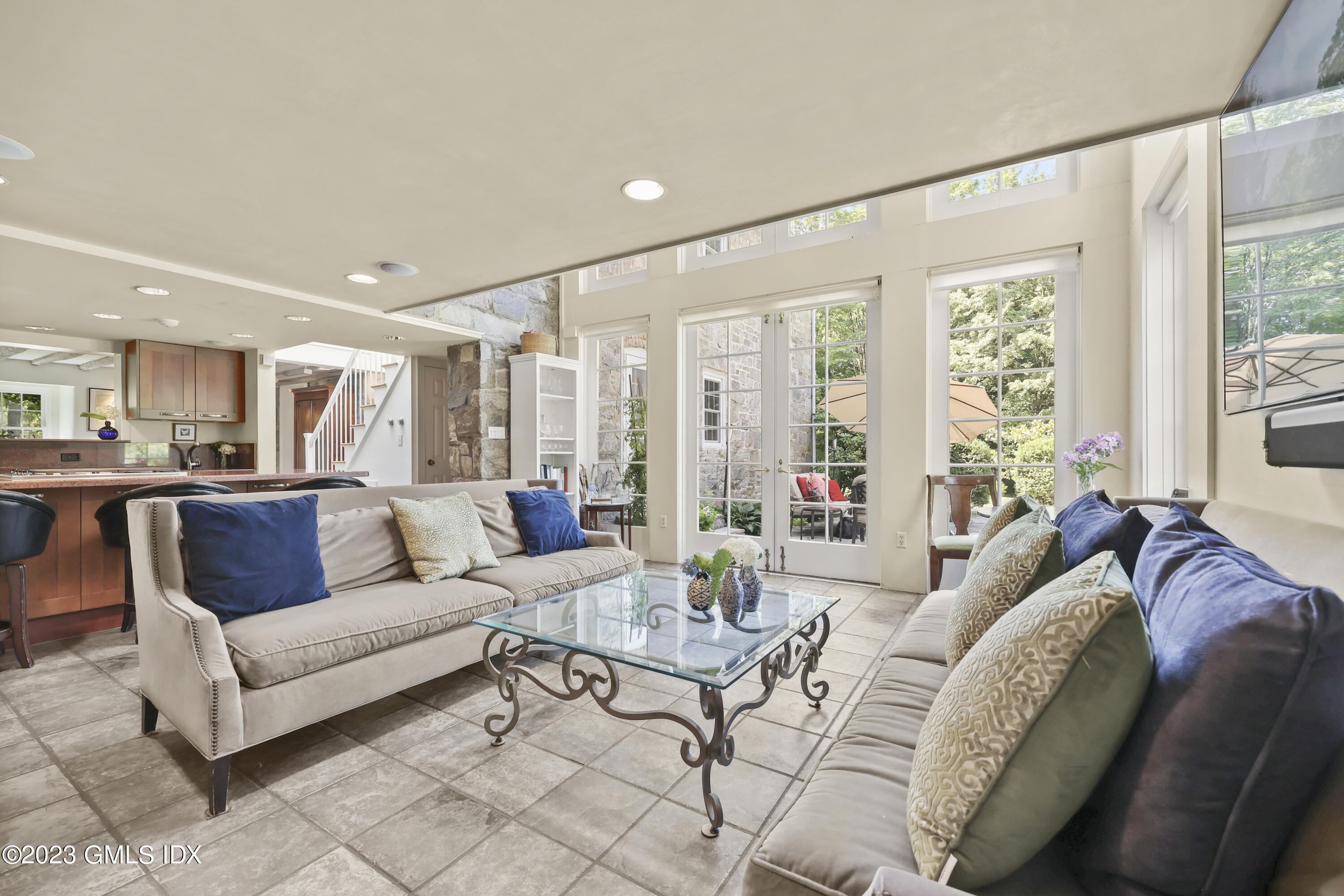 207 Farms Road Stamford, CT 06903 - Photo 20 of 47 a living room with furniture and a large window