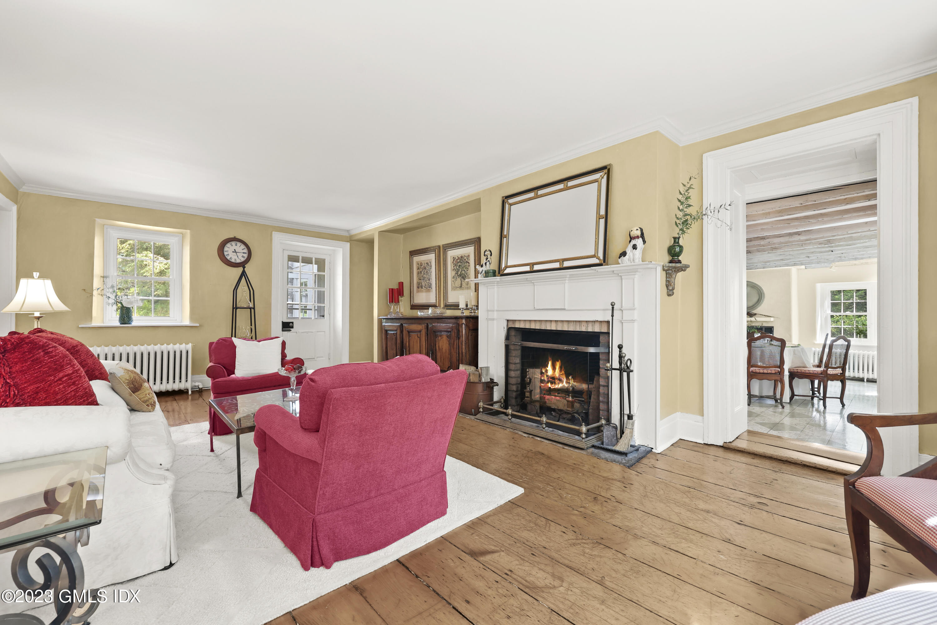 207 Farms Road Stamford, CT 06903 - Photo 23 of 47 a living room with furniture and a fireplace