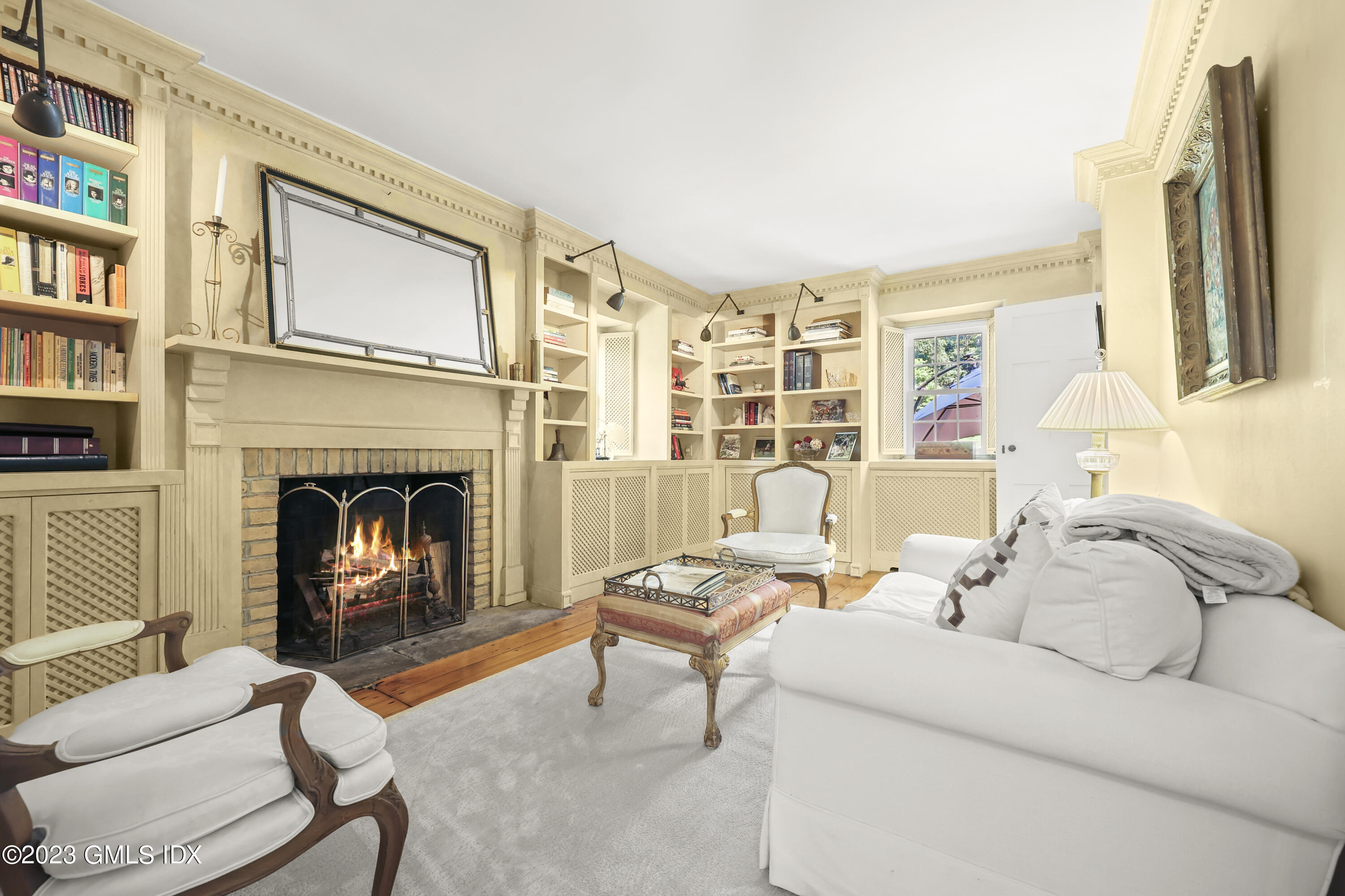 207 Farms Road Stamford, CT 06903 - Photo 24 of 47 a living room with furniture fireplace and a large window