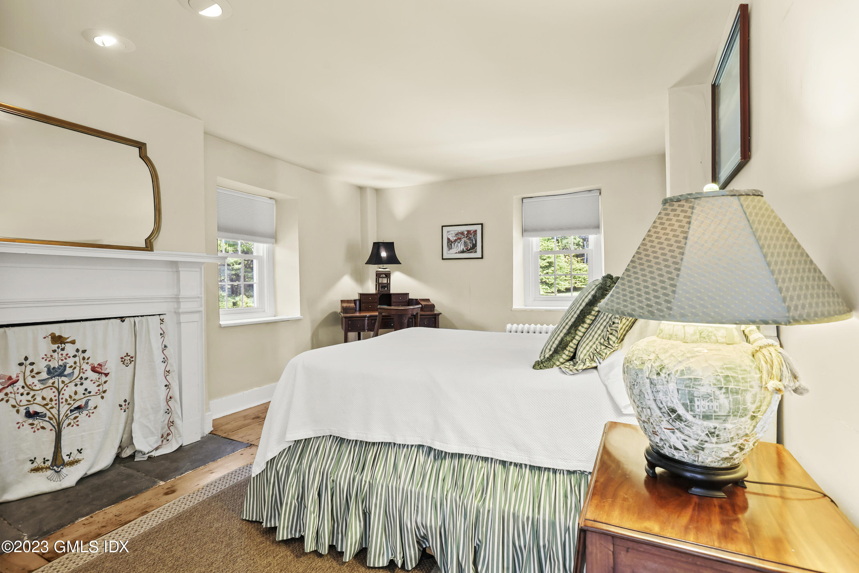 207 Farms Road Stamford, CT 06903 - Photo 29 of 47 a bedroom with a bed and a flat tv screen on the dresser