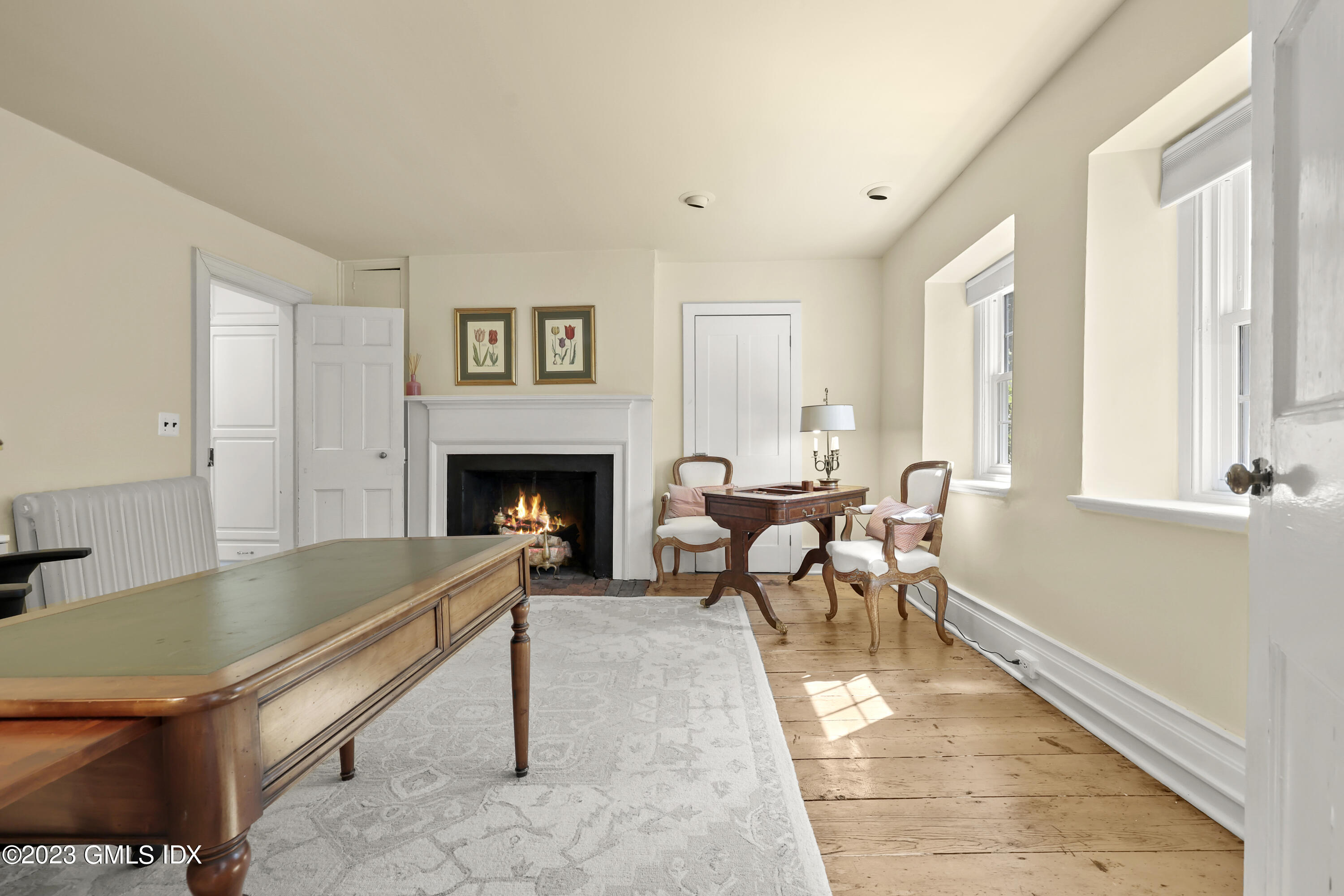 207 Farms Road Stamford, CT 06903 - Photo 31 of 47 a living room with furniture a window and a fireplace