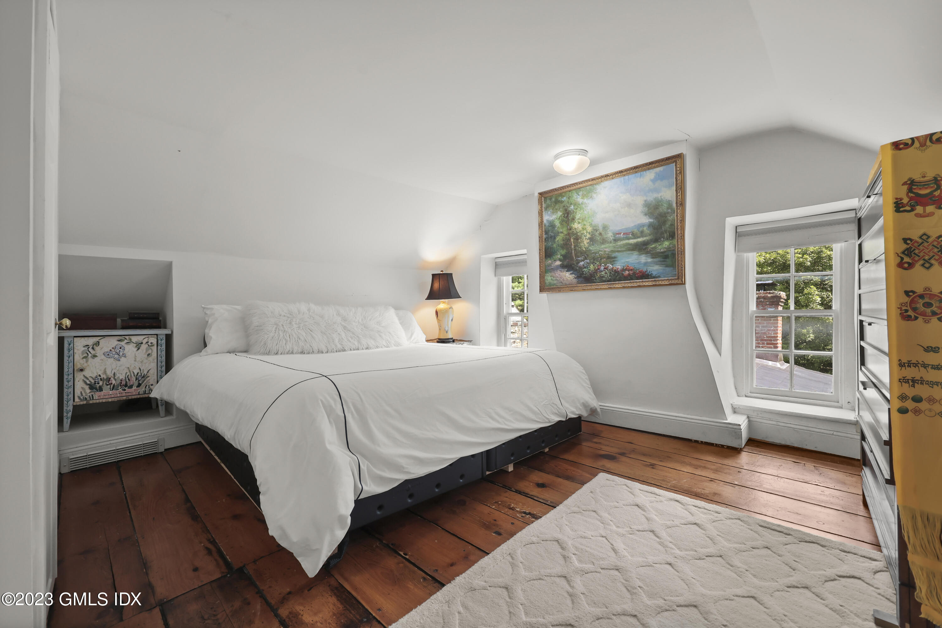 207 Farms Road Stamford, CT 06903 - Photo 33 of 47 a bedroom with a bed and wooden floor