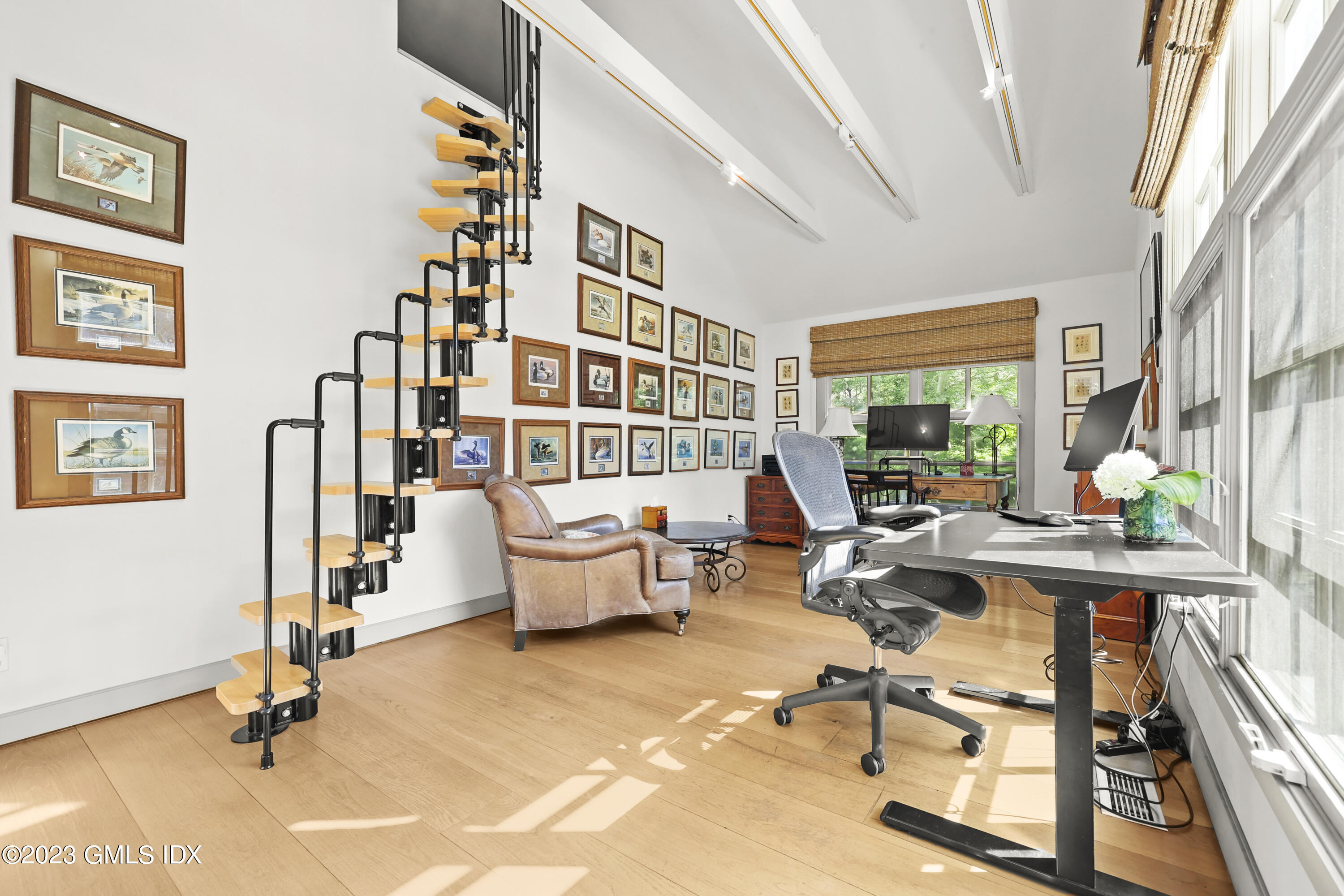 207 Farms Road Stamford, CT 06903 - Photo 36 of 47 a living room with furniture gym equipment and a large window