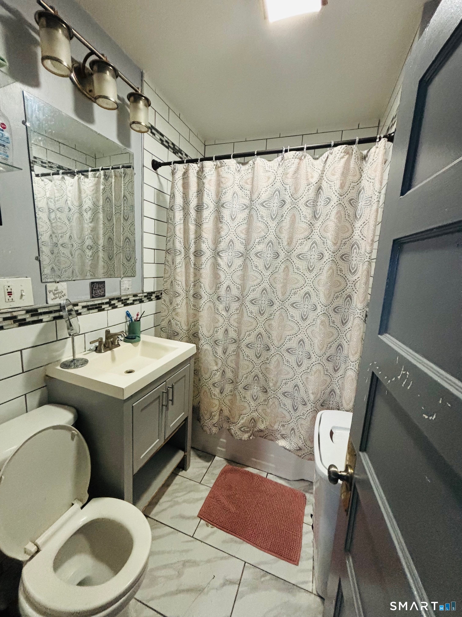 203 Lenox Avenue Bridgeport, CT 06605 - Photo 11 of 12 a bathroom with a sink toilet and shower