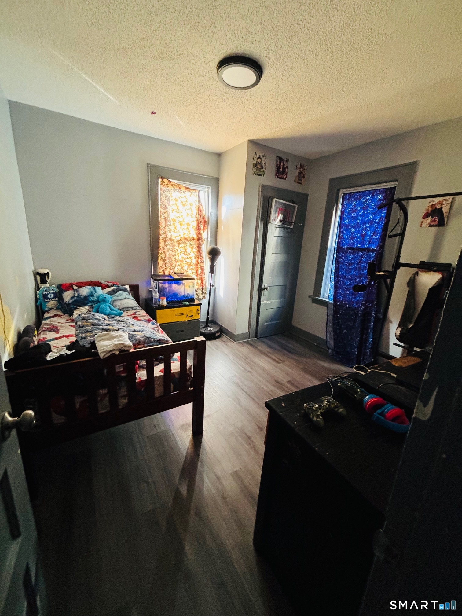 203 Lenox Avenue Bridgeport, CT 06605 - Photo 12 of 12 a bedroom with furniture and a window