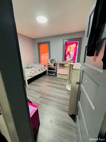 a room with furniture and a flat screen tv