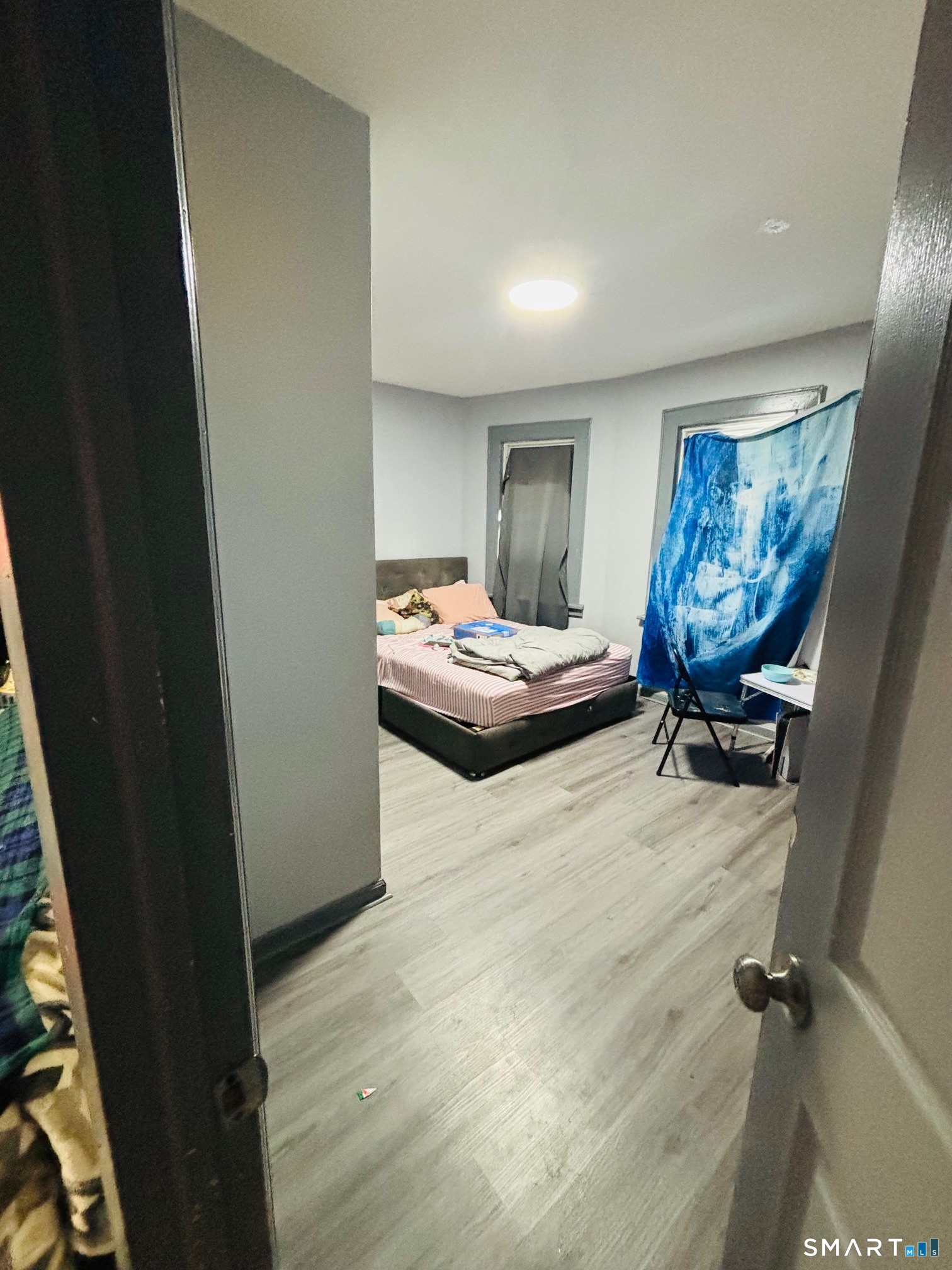 203 Lenox Avenue Bridgeport, CT 06605 - Photo 8 of 12 a bedroom with a bed and furniture