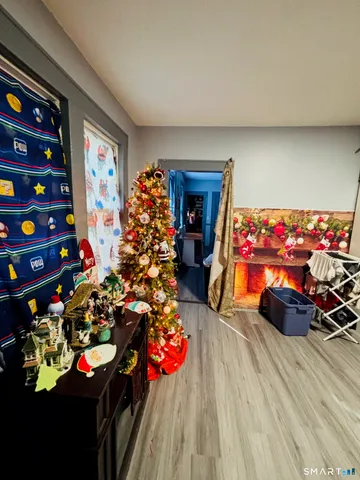 a room with furniture and a flat screen tv