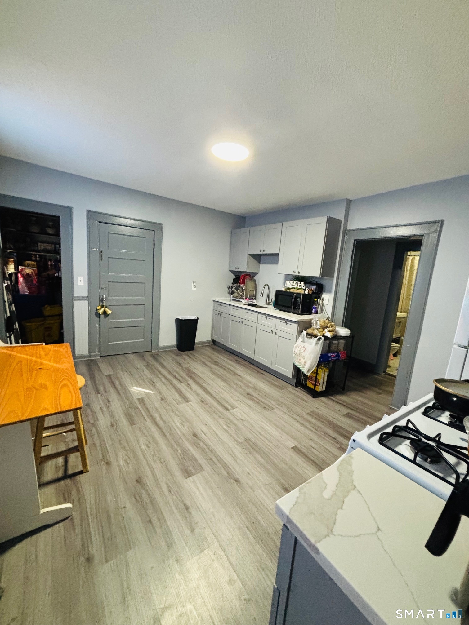 203 Lenox Avenue Bridgeport, CT 06605 - Photo 10 of 12 a room with furniture and a flat screen tv