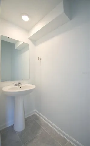 a bathroom with a sink and mirror