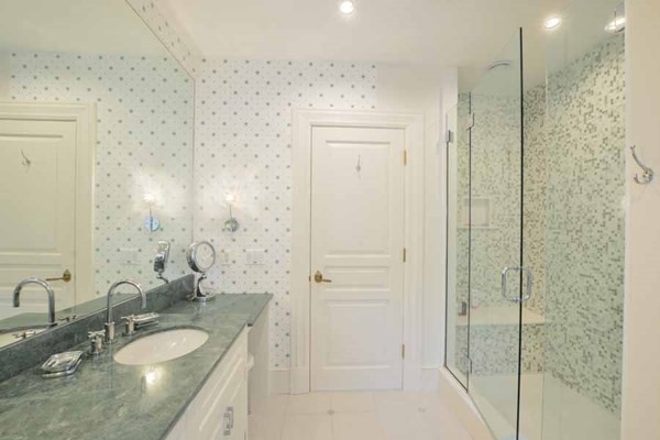 25 Oyster Way Barnstable, MA 02655 - Photo 36 of 42 a bathroom with a granite countertop sink a mirror and shower