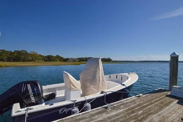 a view of roof deck with chair and wooden floor