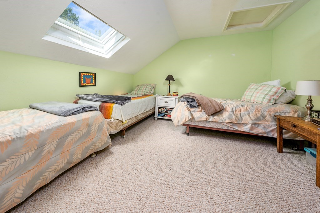 17 North Ridge Road, Unit 444 Mashpee, MA 02649 - Photo 15 of 18 a bedroom with two beds and a couch