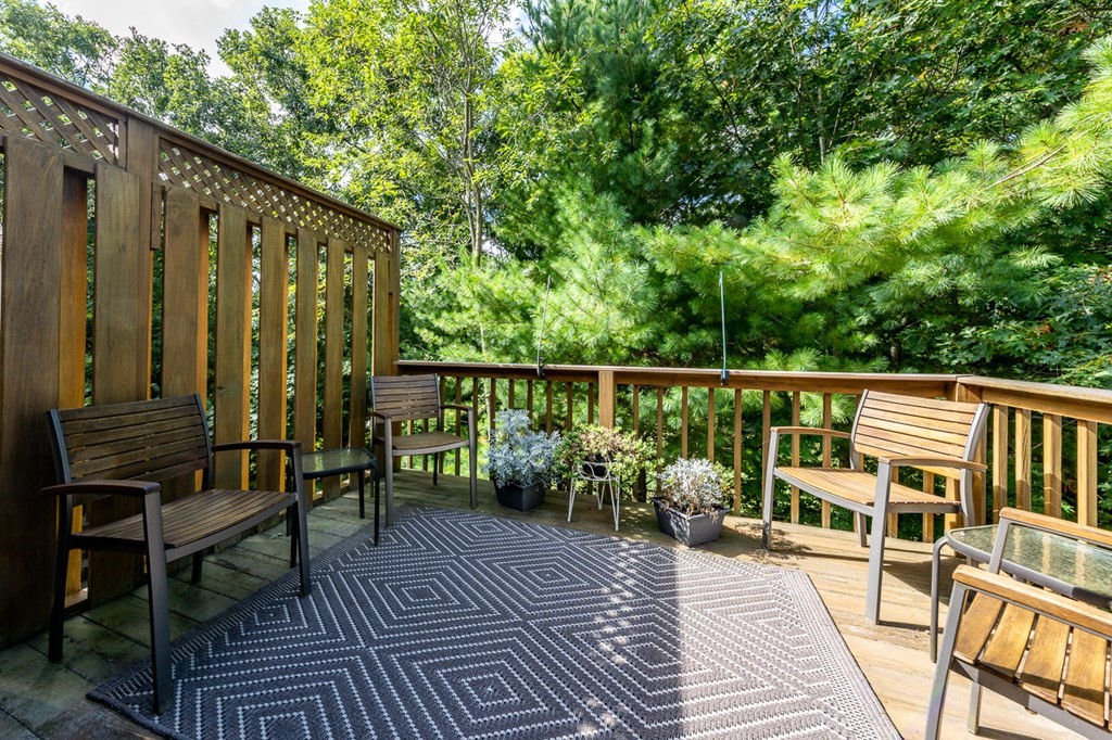 17 North Ridge Road, Unit 444 Mashpee, MA 02649 - Photo 7 of 18 a balcony with wooden floor and outdoor seating