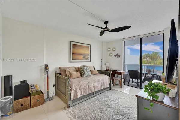 a bedroom with a bed and dresser