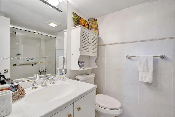 a view of a kitchen with furniture and a potted plant