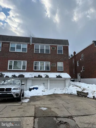 a front view of a house with parking