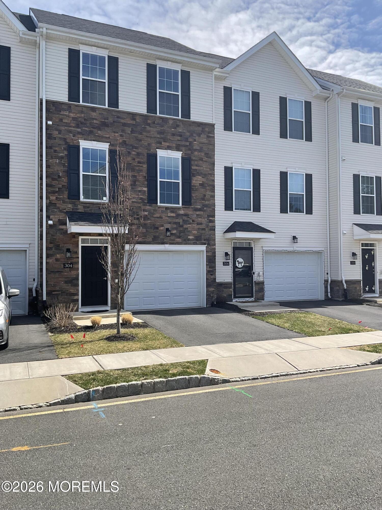 304 Prestige Road, Unit 2404 Brick, NJ 08723 - Photo 1 of 25 a view of building with car parked