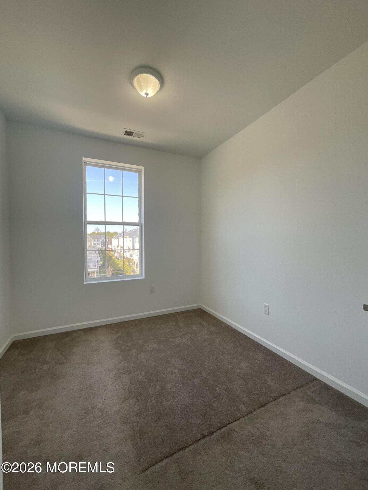 304 Prestige Road, Unit 2404 Brick, NJ 08723 - Photo 16 of 25 an empty room with a window