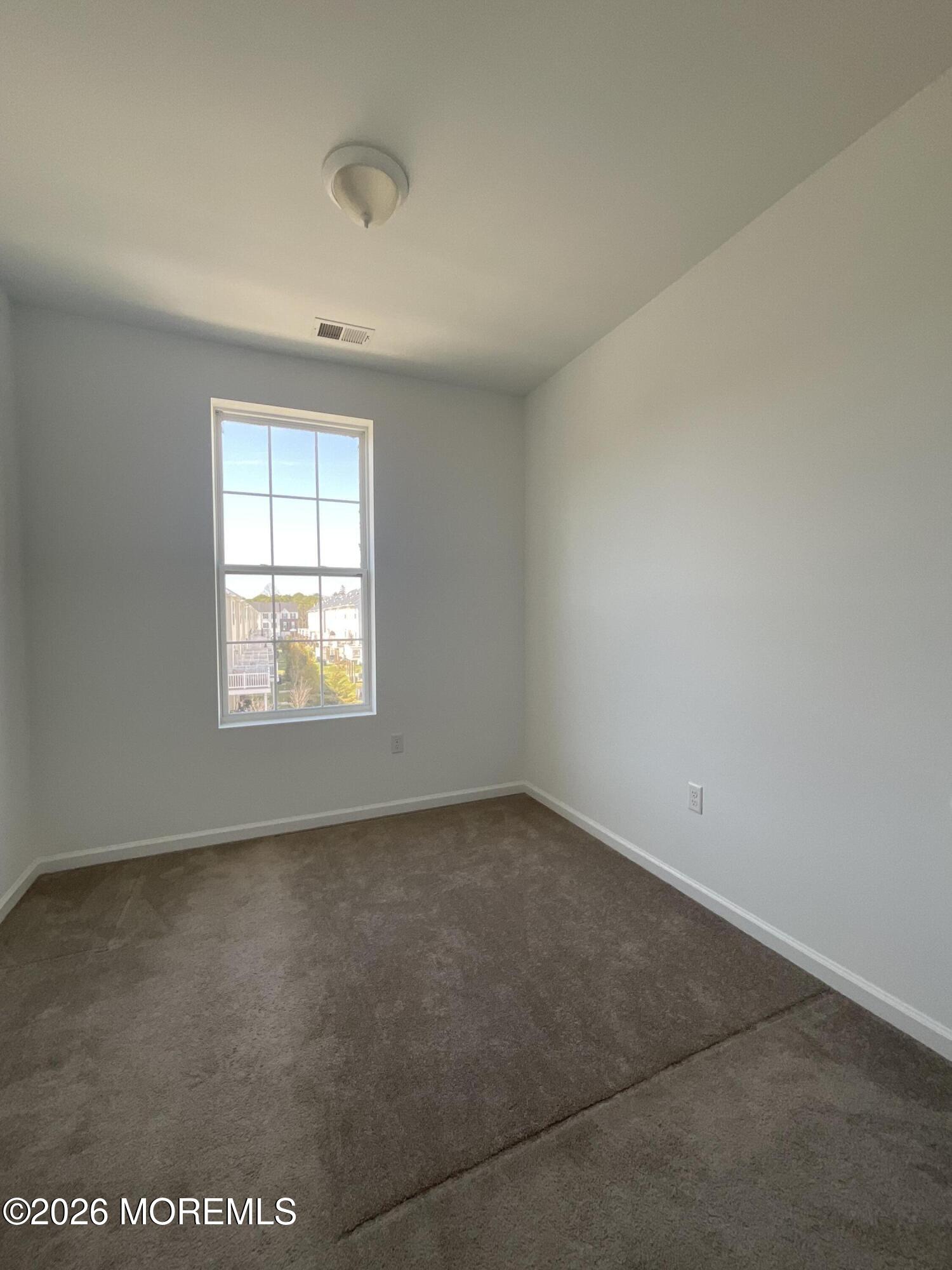 304 Prestige Road, Unit 2404 Brick, NJ 08723 - Photo 17 of 25 an empty room with a window