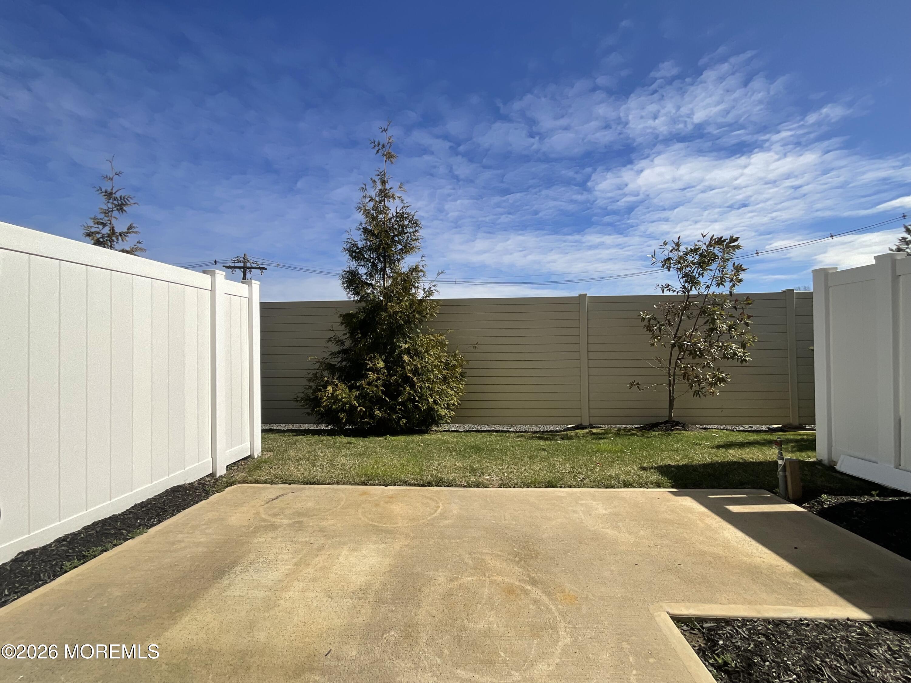 304 Prestige Road, Unit 2404 Brick, NJ 08723 - Photo 23 of 25 a view of a backyard